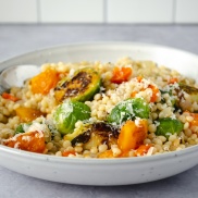 Warm and comforting winter or fall vegetable pot of pearl couscous with brussel sprouts and squash. Easy, healthy, filling, plant-based, vegan recipe