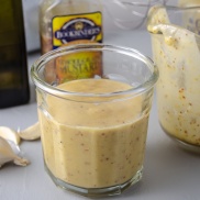 Jar of versatile homemade vinaigrette salad dressing, a bright dressing made from vinegar, mustard, garlic, and olive oil