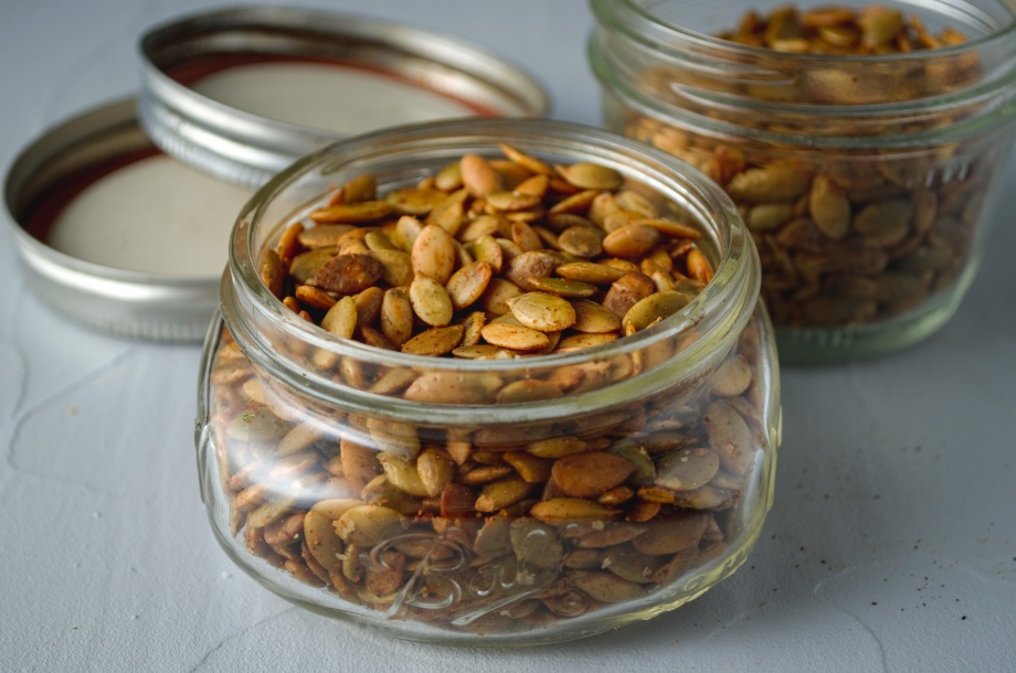 Jar of roasted toasted smoky flavored pepitas (pumpkin seeds) for topping soups and salads