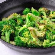 A pan of cooked broccoli using the steam saute technique