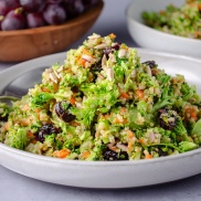 Broccoli salad blitzed in a food processor and topped with quinoa, carrots, dried cranberries, and sunflower seeds. Easy, healthy, filling, plant-based, vegan recipe