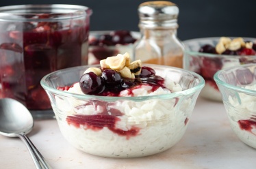 Coconut Rice Pudding topped with homemade Mixed Berry Sauce