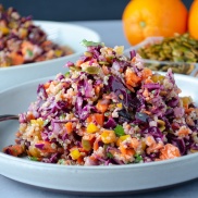 Cabbage salad blitzed in a food processor and topped with carrots, quinoa, dried apricots, pepitas (pumpkin seeds), and cilantro. Easy, healthy, filling, plant-based, vegan recipe