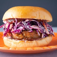 Vegan plant-based protein-packed barbeque bean burger topped with cabbage coleslaw
