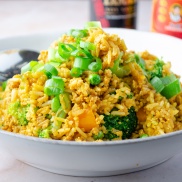 Vegan fried rice with tofu scrambled "eggs," broccoli, and carrots