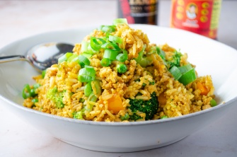 Vegan fried rice with tofu scrambled "eggs," broccoli, and carrots