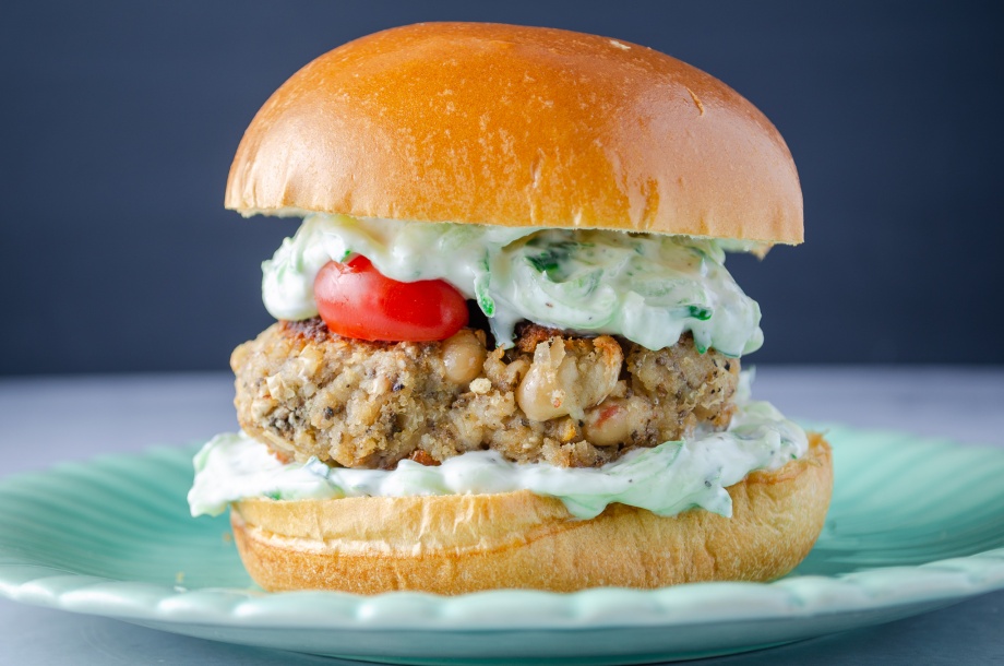 A gyro-flavored protein-packed vegan bean burger topped with homemade tzatziki