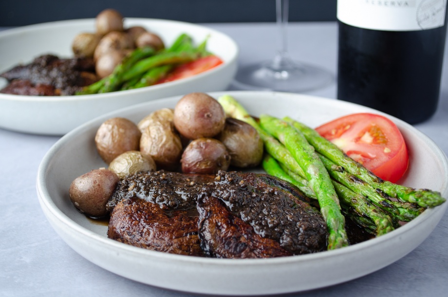 Grilled Portobello Mushroom "steak" with red wine mushroom sauce and served with asparagus and potatoes