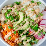 Vegan chickpea "Tuna" poke bowl with white rice, avocado, radishes, cucumber, and shredded carrots