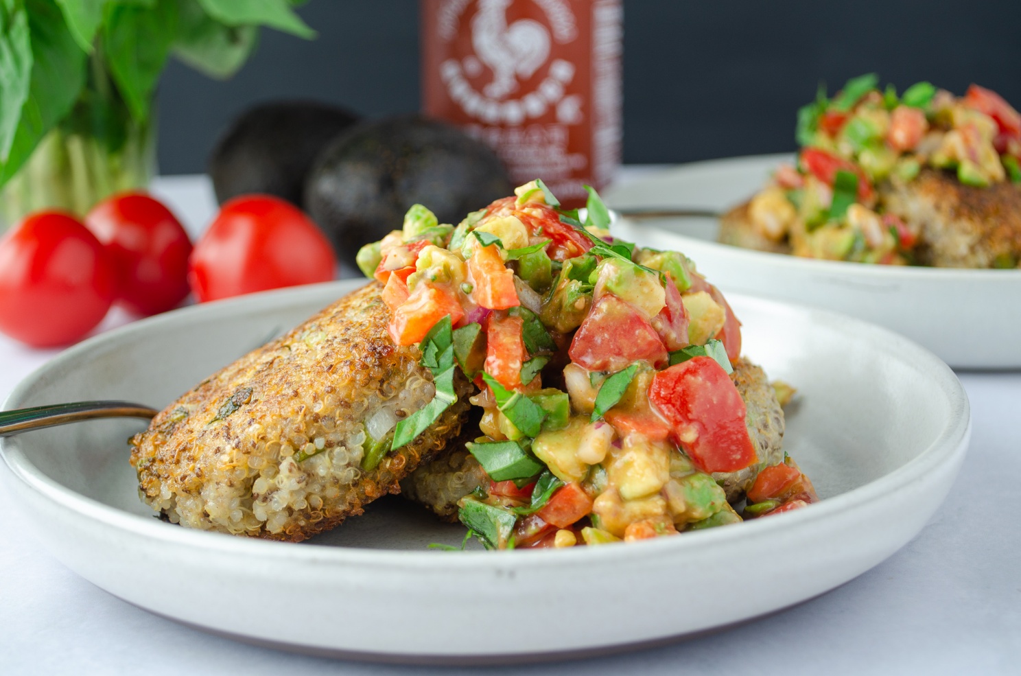 Cumin quinoa cakes, a vegan complete-protein meal served with a fruit salsa