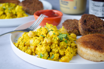 Vegan protein-full breakfast of tofu scrambled eggs with chickpeas and salsa verde