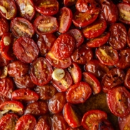 A tray of cherry tomato confit roasted with garlic until golden brown