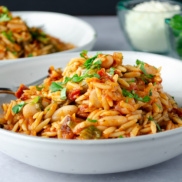 One-Pot Baked Pasta with sundried tomatoes, escarole, and hearty white beans for protein.