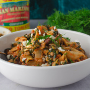 One-pot baked pasta with kalamata olives, spinach, vegan dairy-free feta, and chopped fresh dill