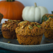 A plate of warm and cozy pumpkin spice muffins that are vegan, egg-free, and filling
