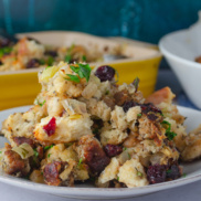 Vegan "sausage" stuffing or dressing for your Thanksgiving celebration flavored with cranberries, spices, vegan sausage, and broth