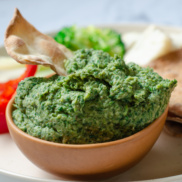A bowl of our smoky, zesty kale-white bean dip, an integral part of our plant-rich, vegan festival holiday board