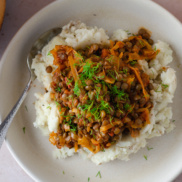 A warm, hearty, plant-based entree of lentil stew flavored with cabbage and caraway