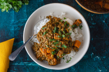 A warm, hearty, plant-based entree of lentil stew flavored with curry