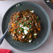 A warm, hearty, plant-based entree of lentil stew flavored with middle eastern spices