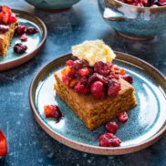 A festive vegan molasses spice cake with cranberry relish and whiskey hard sauce