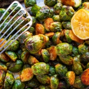 A tray of roasted brussels sprouts with smoked paprika, and a dash of lemon juice