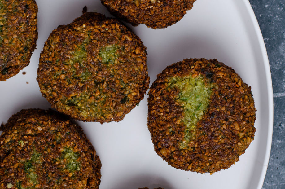 A plate of baked or fried falafel patties to make plant-based entrees like wraps, burgers, or salads