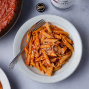A warm bowl of plant-based penne vodka that's creamy and dairy-free