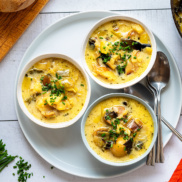 Bowls of warm and satisfying leek and potato soup that is as simple as dumping roasted vegetables, broth, and coconut milk in a pot and heating it up
