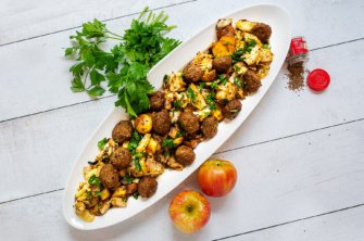 A sheet pan tray of plant-based meatballs,