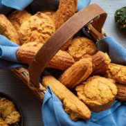 A basket of plant-based, vegan, creamy cornbread, corn muffins, and corn sticks for your fall or Thanksgiving celebration