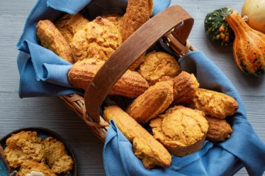 A basket of plant-based, vegan, creamy cornbread, corn muffins, and corn sticks for your fall or Thanksgiving celebration